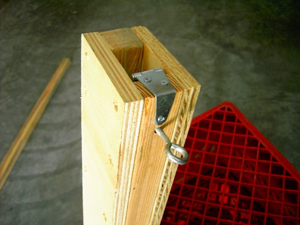 Bottom end of tripod leg showing the outside overlap of the height locking strap hinge. Click to enlarge image!