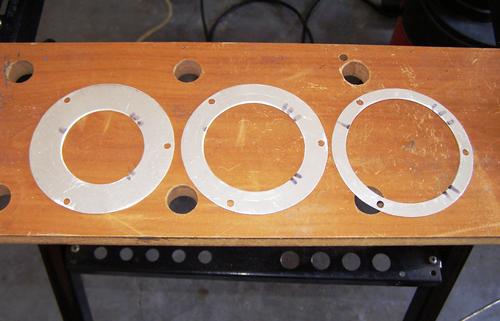 The finished baffles ready to be installed on the three threaded rods.