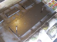 The dovetail plate curing after being painted with Rustoleum� Hammered-Finish spray paint.