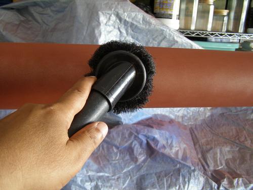 Light sanding and vacuuming to primed main tube before painting.