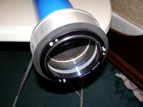 Installed front and rear objective cell components with lens.