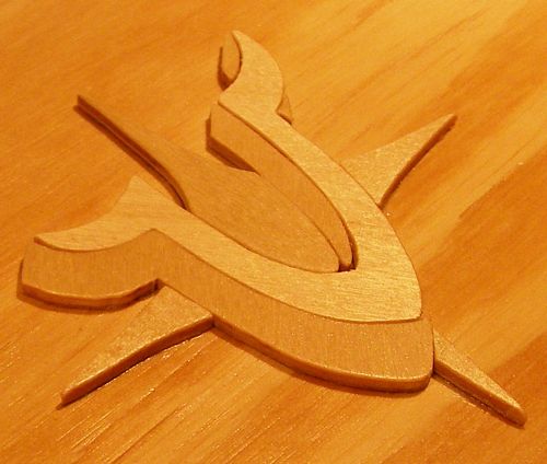 Cradle Ring Hinge Plates being shaped on a bench grinder.